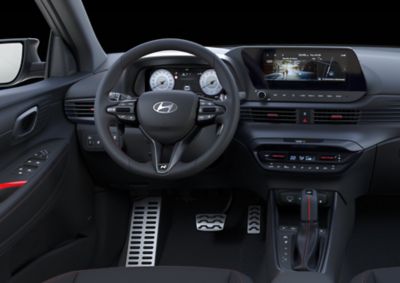 The i20 N Line steering wheel, gear knob, and aluminium-look sports pedals.