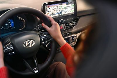 Woman driving the Hyundai i30.