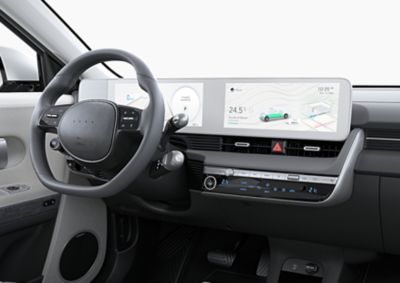 The interior of the Hyundai IONIQ 5 midsize electric CUV showing the steering wheel and digital cluster.