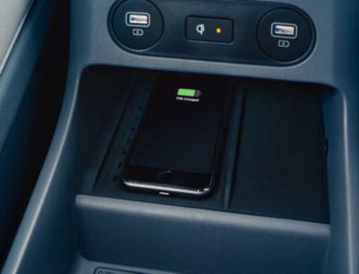 The Hyundai IONIQ 5 electric CUV's high-speed wireless charger ports in the front and back seats.