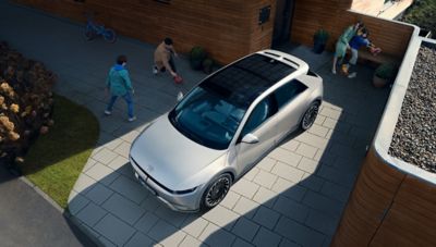 Hyundai IONIQ 5 electric midsize CUV parked in a driveway, seen from above.