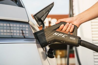 A Hyundai IONIQ 5 getting plugged in to an IONITY Combined Charging System.