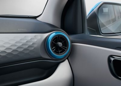 Customized circular airvent trims on the Hyundai i10 in Aqua turquoise.