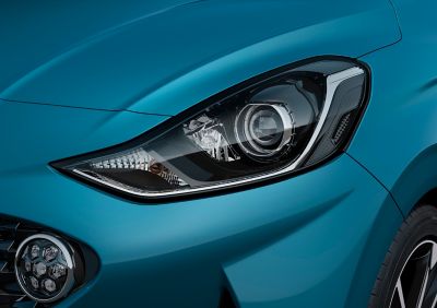 A close up look at the all-new Hyundai i10's new Bi-function projection headlamps and LED Daytime Running Lights.	
