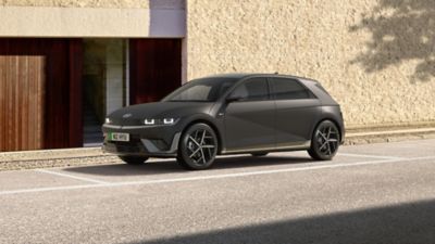 Hyundai IONIQ 5 N Line parked in front of a house.