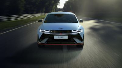 Front view of the all-electric Hyundai IONIQ 5 N on a wide road. 