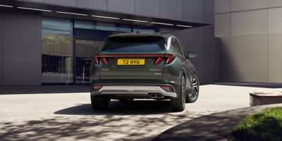 Rear view of the Hyundai TUCSON Plug-in Hybrid in Cypress Green.