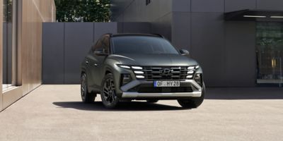 Hyundai TUCSON 20th Anniversary Edition with Pine Green Matte exterior colour from the front.