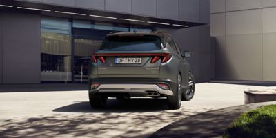 Hyundai TUCSON 20th Anniversary Edition with Pine Green Matte exterior colour from the rear.	