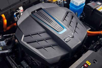 The battery-powered electric engine of the Hyundai KONA Electric in an opened hood.