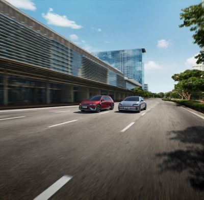Hyundai IONIQ 5 and IONQ 6 driving along the road.
