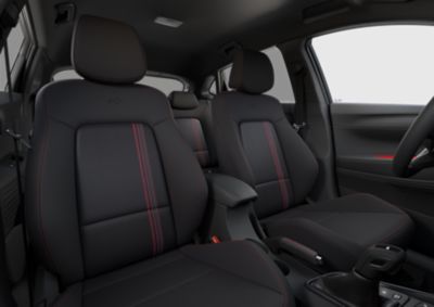 A wide-angle view of the Hyundai i20 N Line's interior, showing the distinct red colour accents.