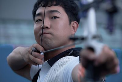 Paralympic athlete Jun-beom Park, aiming his arrow