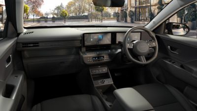 The inside front-view of the Hyundai KONA Electric and its large seats.