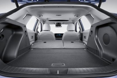 The inside of the Hyundai KONA Electric shows the flexibility of the 40:20:40 folding rear seats.