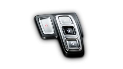 Detailní obrázek tlačítka typu shift-by-wire v novém SUV Hyundai Santa Fe.