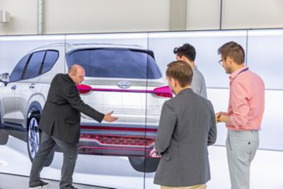 Four designers discussing the rear design of the Hyundai Santa Fe 7 seat SUV.