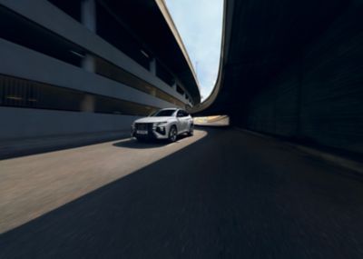 Hyundai TUCSON N line on driving on the road.