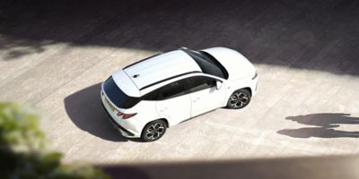 The Hyundai TUCSON Plug-in Hybrid pictured from above parked in the street. 