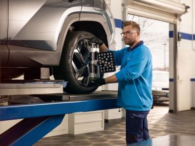 Hyundai technician aligning a wheel.