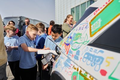 School children learning about the charging on an IONIQ 5.