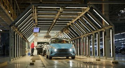 A Hyundai KONA leaving a Hyundai production site.