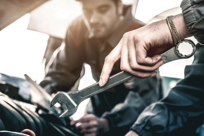 Maintenance being performed on the engine of a Hyundai vehicle.