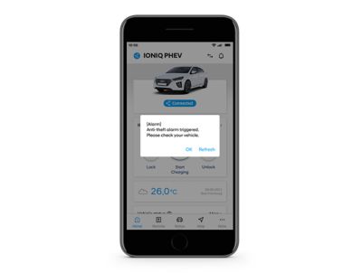 Close-up of the Hyundai Bluelink app with a theft detection push notification.