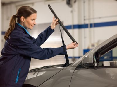 Hyundai employee installs new windshield wipers.