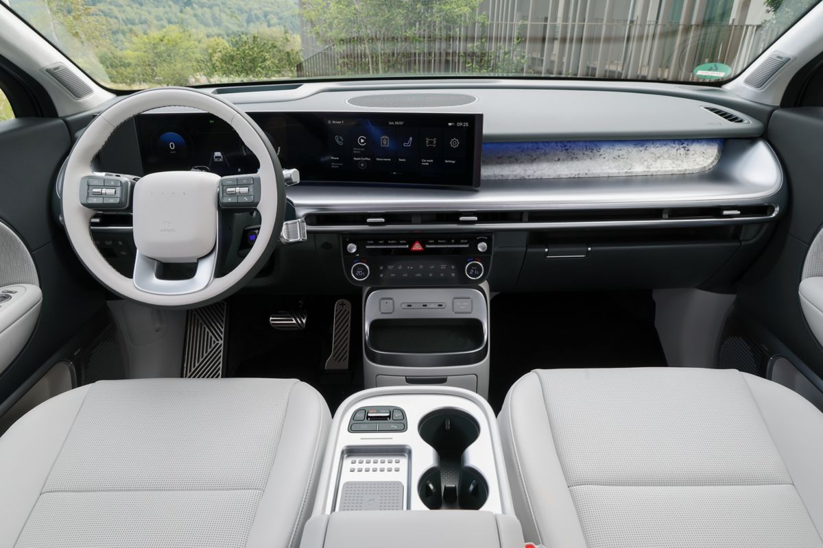 Six-seat interior layout with second-row captain's chairs and sliding centre console
