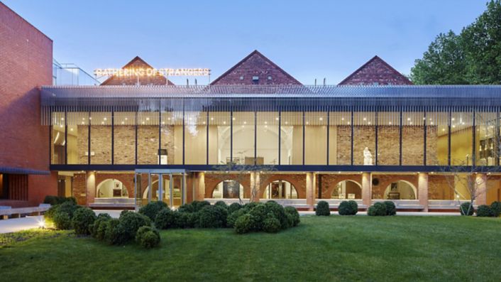 Image 3: Exterior image of the Whitworth, 'Gathering of Strangers' artwork by Nathan Coley (2007). Photograph by Alan Williams ⓒ the Whitworth, The University of Manchester