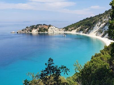 An ocean bay in Ithaca, Greece with turquoise-coloured water.