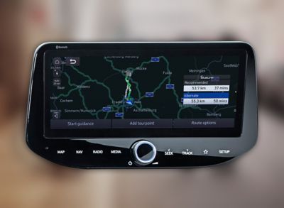 Close-up of a Hyundai touchscreen showing navigation with connected routing.