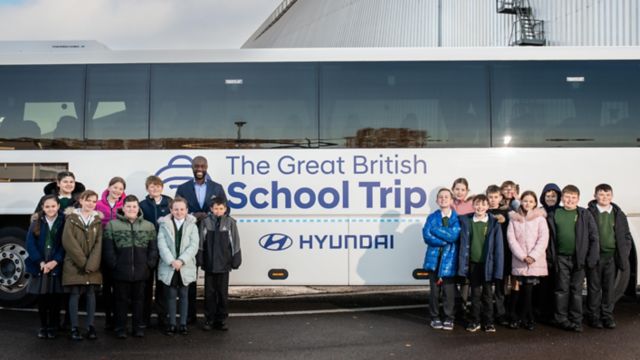 Schoolchildren in front of the GBST coach