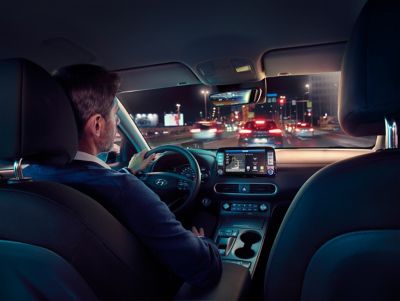 A man driving the Hyundai IONIQ 5 hearing other sounds more loudly due to the lack of engine sounds.