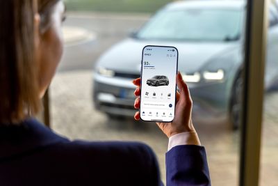 Hyundai electric vehicle owner using the myHyundai app.
