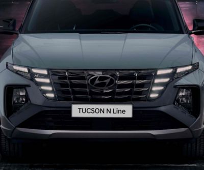 Detail of the Hyundai TUCSON N Line front grille and headlamps.