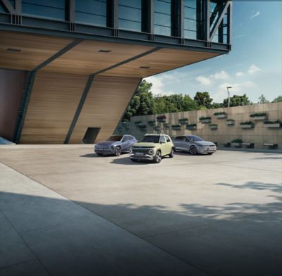 Hyundai Concept THREE on a moon-like surface under a starry sky, featuring a sleek design.