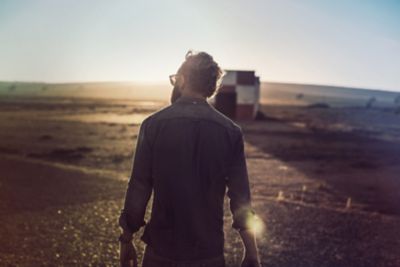 A man stood in the countryside.