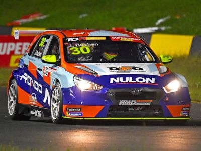 The Hyundai VELOSTER N TCR on a racetrack.