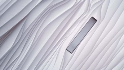 Textured pattern of flowing vertical lines resembling layered fabric.
