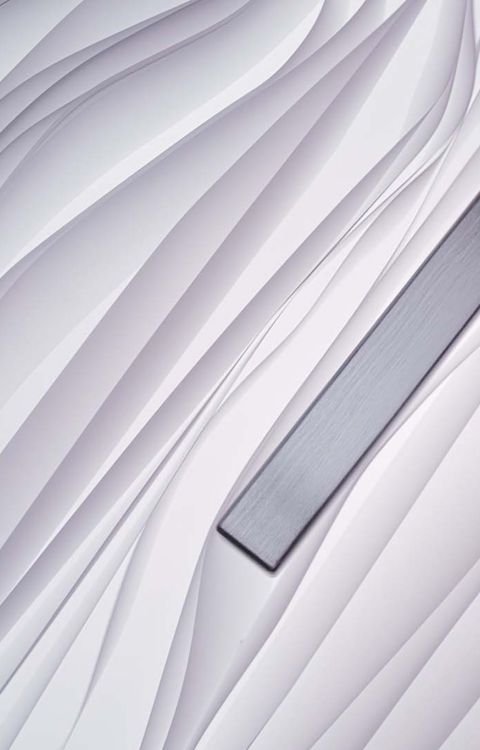 Textured pattern of flowing vertical lines resembling layered fabric.