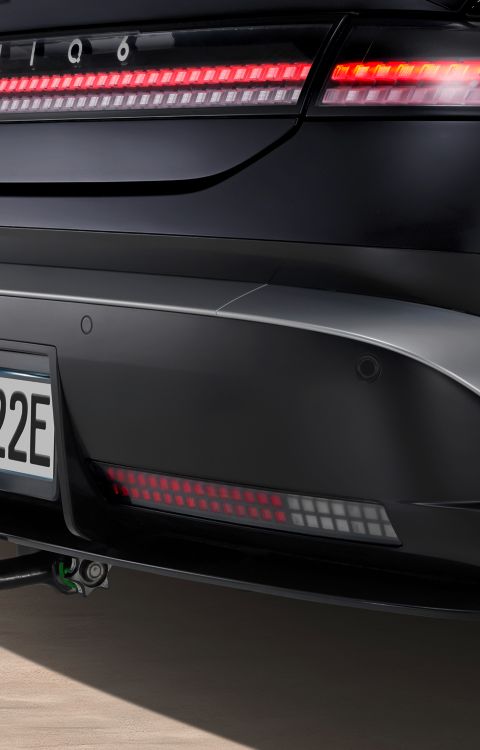 Hyundai IONIQ 6 with mounted tow bar detachable transport accessory.