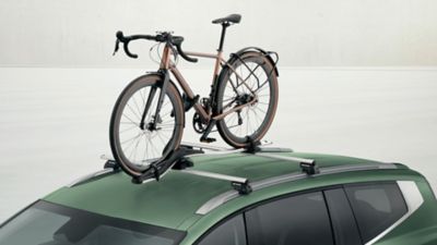 Hyundai IONIQ 9 with cross bars aluminium and bike carrier plus transport accessories.