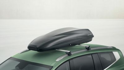 Hyundai IONIQ 9 with cross bars aluminium and roof box transport accessories.