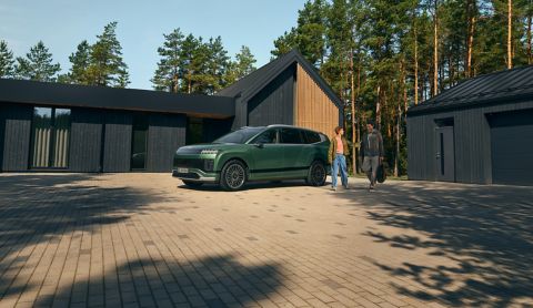Hyundai IONIQ 9 electric SUV parked in front of a house.