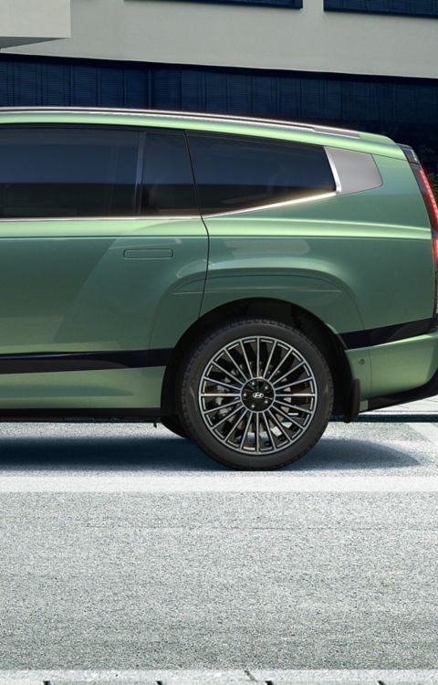 Side view of green Hyundai IONIQ 9 electric SUV.
