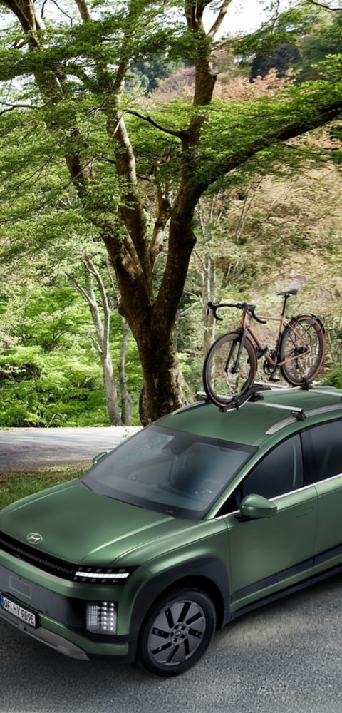 Hyundai IONIQ 9 with cross bars aluminium and bike carrier plus transport accessories.