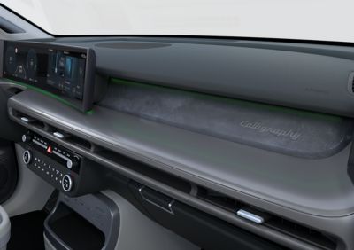 Green ambient lighting dashboard inside the Hyundai IONIQ 9 electric SUV.