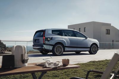 Hyundai IONIQ 9’s Vehicle-to-Load technology powering a coffee maker at a camp site.